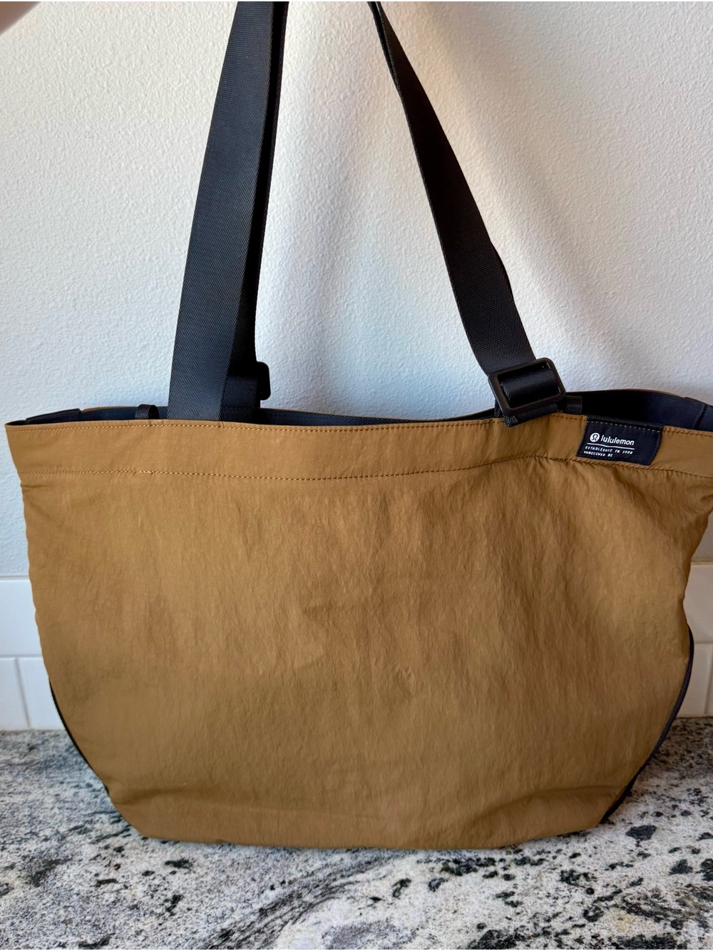 lululemon Clean Lines Tote Bag 22L in the Burnt Caramel / Black.